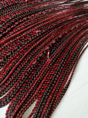 braids on a wood background at close range