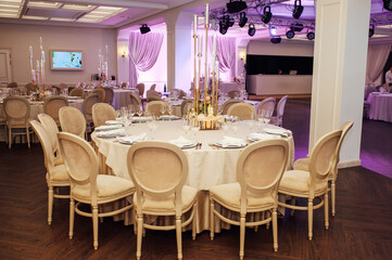 Banquet decorated table, with cutlery. Wedding decor in the banquet hall.