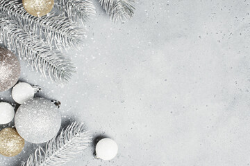 Christmas background with frosted Christmas tree branches and baubles
