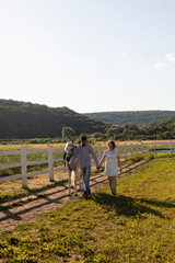 Fototapeta na wymiar Couple walk at the ranch during summer day
