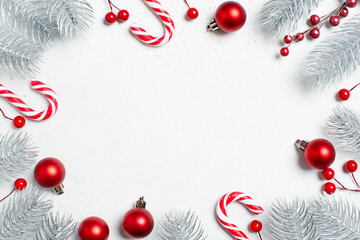 White Christmas background with Christmas tree branches and red baubles - 461692492