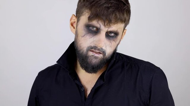 a man with undead makeup for Halloween