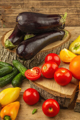 Assortment of fresh vegetables on a wooden background