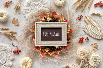 Hashtag Its Fall yall on black board. Off white natural Fall decorations. Flat lay on white...