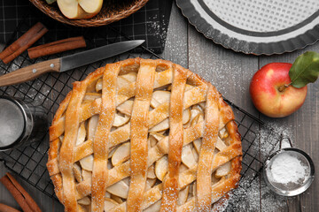 Delicious traditional apple pie on table, flat lay