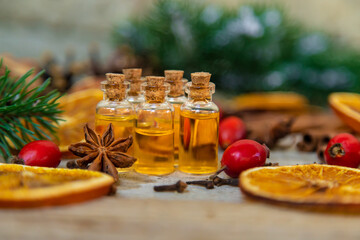 Christmas essential oils in small bottles. Selective focus.