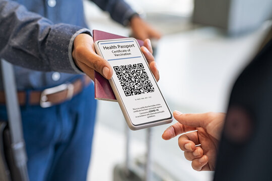 Man showing health vaccination passport to stewardess before flight