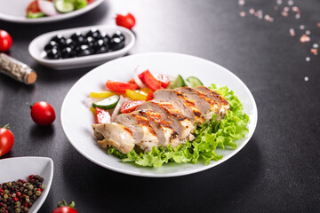 chicken salad vegetables, chicken breast grill fresh portion ready to eat meal snack on the table copy space food background rustic. top view keto or paleo diet
