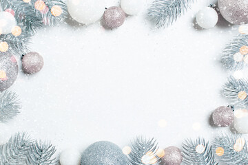 Fototapeta na wymiar Christmas background with frosted Christmas tree branches and baubles