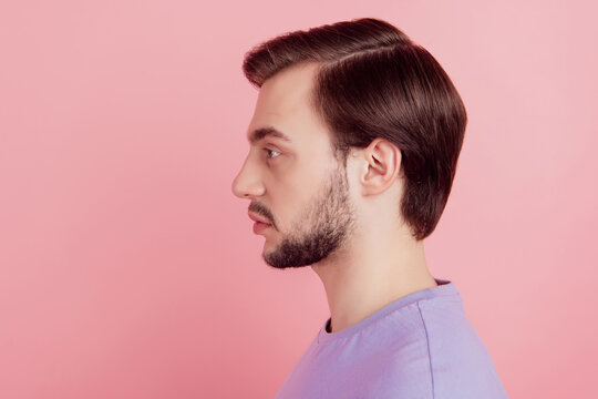Profile side view photo of brutal minded pensive guy look copyspace isolated over pink color background