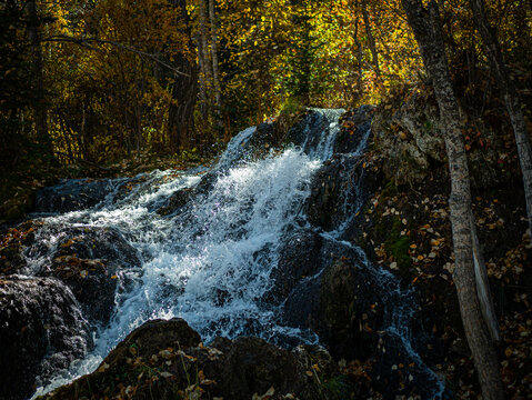 Natural view of a small waterfall at Big Spring Hills Park west Airdrie in Alberta, Canada