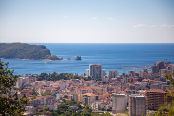 Fototapeta premium Aerial view at the Budva city with modern buildings and sea. Montenegro, Europe