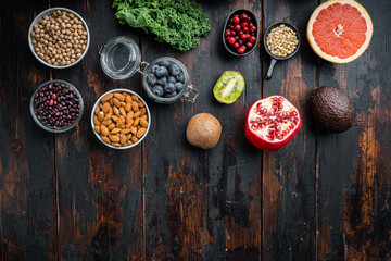 Obraz na płótnie Canvas Healthy food and diet concept, top view on dark wooden background, with copy space