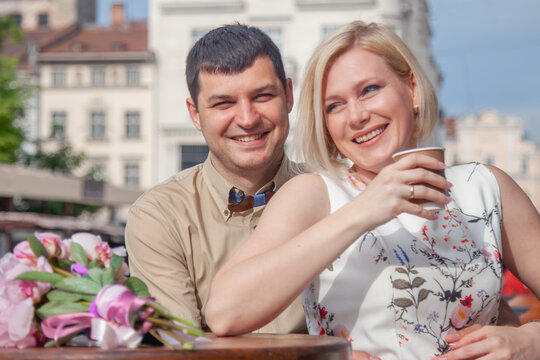 Lovely happy people. Romantic photo of married couple in love enjoying morning coffee .