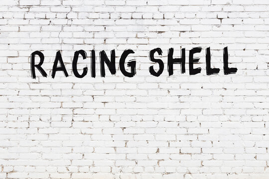 Inscription Racing Shell Painted On White Brick Wall