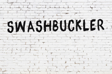 Inscription swashbuckler painted on white brick wall - obrazy, fototapety, plakaty