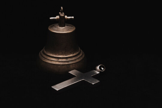 Religion and culture. Symbol of faith and hope, bell and cross. God is always with us.