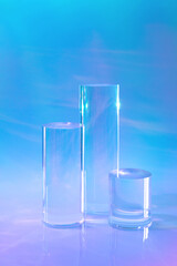 Abstract surreal scene - empty stage with three clear glass cylinder podiums on pastel holographic...