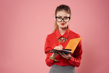 woman in red shirt secretary office work pink background