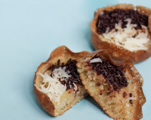 Mini moonlit cake with chocolate and cheese topping. This cake is very easy to find along the roadside. This cake is suitable to be eaten at night as a snack with the family. Focus blur.