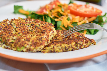 Tasty Quinoa vegetarian burgers made with quinoa, zucchini and onion.
