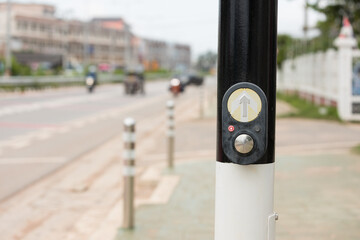 Push Button for traffic light. Use traffic lights at the crossroads. Button of the mechanism lights traffic lights on the street. Crosswalk Pedestrian Signal Button and Sign.