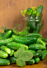Food background. Organic products, healthy food, harvesting for future use, pickling vegetables, pickling cucumbers. Cucumbers with garlic, salt, dill and empty glass jar for pickling.