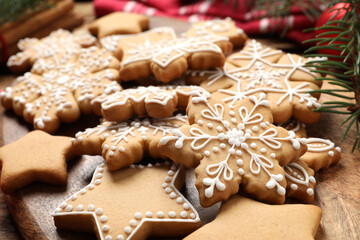 Fototapeta na wymiar Tasty Christmas cookies on wooden table, closeup