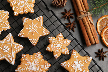 Tasty Christmas cookies and spices on grey table, flat lay
