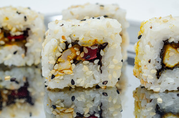 Closeup of katsu chicken and red pepper California roll, traditional