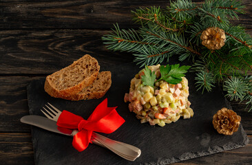 Traditional Russian New Year salad Olivier, New Year's or Christmas salad serving