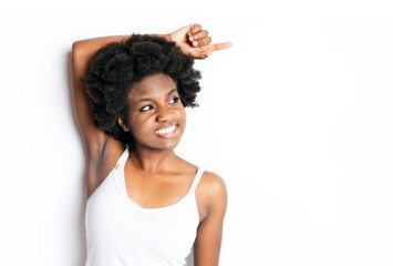 Young black African teen Isolated On White Background pointing something
