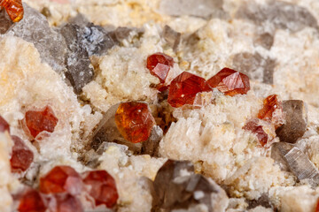 Macro mineral stone Spessartine, Feldspar, Smoky quartz, on a white background