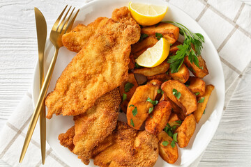 crispy Chicken Cutlets with spicy roasted potatoes