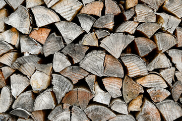 The background is made of old firewood. Preparation for winter.