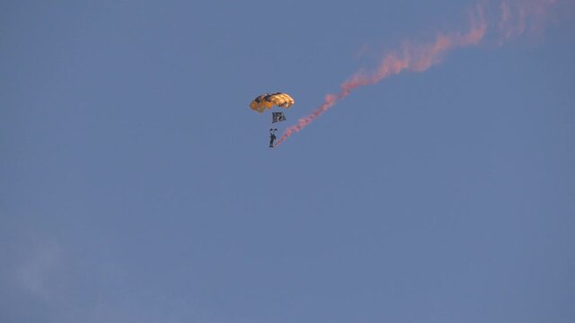parachuter with smoke coming out