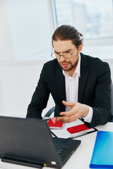 Fototapeta premium businessman work in the office in front of a laptop executive