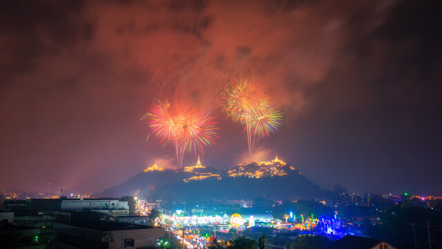 Firework and smoke sparkling in dark sky over the hills at Phetchaburi, Phra Nakhon Khiri, Khao Wang, Thailand. Khao Wang fireworks Festival.