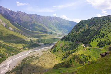Fototapeta na wymiar Mountain landscape. View of the Georgian military road, mountains and clouds