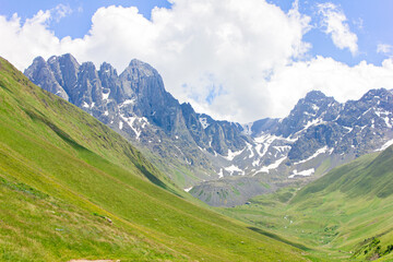 Fototapeta premium Mountain landscape with a view of the valley and Mount Chaukhi