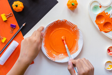 Cuts of paper for Halloween. Hand cut paper. Pumpkins. Scissors and glue.