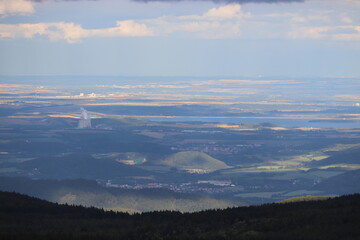 Fototapeta na wymiar A long view to the landscape with factories during storm at Ore mountains, Czech republic