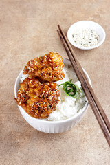 Ayam goreng Korea or Yangnyeom chicken is a fried chicken with Korean sauce with sesame seed, served with rice.