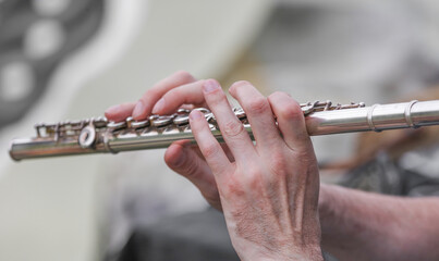 The musician plays the flute.