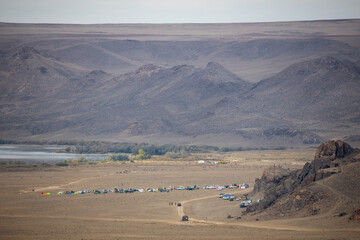 Base camp of the largest trail running ultramarathon "Tengri Ultra" that takes place annually in Central Asia in Tamgaly Tas tract. Republic of Kazakhstan, Almaty Region.