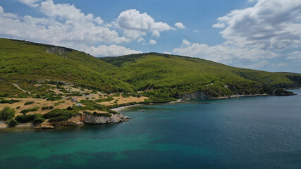 Fototapeta na wymiar Aerial drone photo of beautiful sandy bay and picturesque small chapel of Agios Fokas in island of Skiros, Sporades, Greece