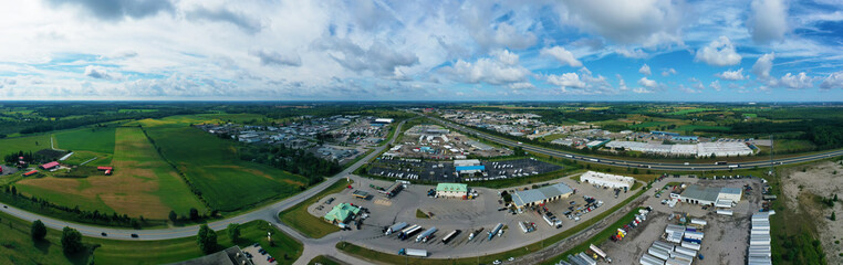 Aerial panorama view of busy expressway by truck stop