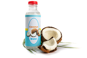 A fake generic labelled bottle of coconut water with broken up coconuts isolated on white
