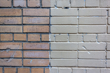 Brick wall two-color wall painted in white and red. Brick wall full frame with two sections of different colours. Brick wall partly red with white grout as background