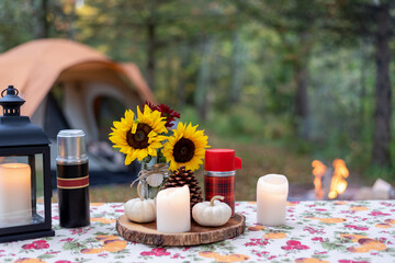 Picnic table decorated for fall at a campsite in autumn - 461746843